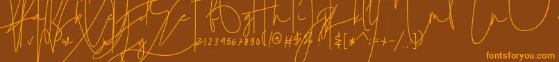 julian thomas-Schriftart – Orangefarbene Schriften auf braunem Hintergrund