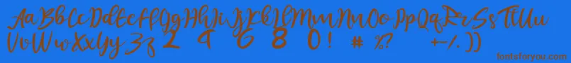 フォントjuliet – 茶色の文字が青い背景にあります。