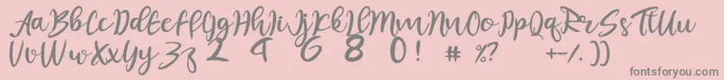 フォントjuliet – ピンクの背景に灰色の文字