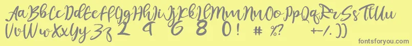 juliet-fontti – harmaat kirjasimet keltaisella taustalla