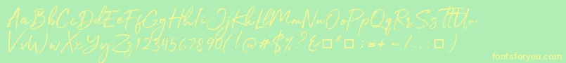 フォントJulietta Messie – 黄色の文字が緑の背景にあります