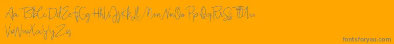 Jullia Script Personal Use Only-Schriftart – Graue Schriften auf orangefarbenem Hintergrund