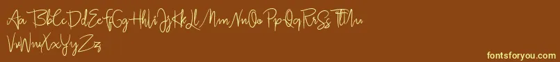 フォントJullia Script Personal Use Only – 黄色のフォント、茶色の背景