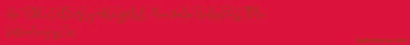 Jullia Script Personal Use Only-Schriftart – Braune Schriften auf rotem Hintergrund