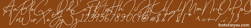 July it-Schriftart – Weiße Schriften auf braunem Hintergrund