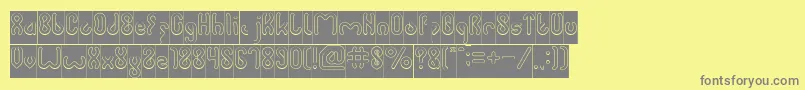 JUSSTA Hollow Inverse-fontti – harmaat kirjasimet keltaisella taustalla