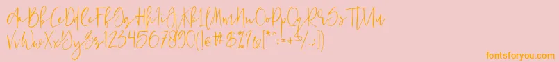 フォントJust Jessy Demo – オレンジの文字がピンクの背景にあります。