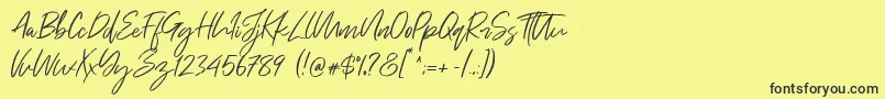 Weitere Informationen zur Just Kelly Justine-Schriftart Just Kelly Justine-Schriftart – Schwarze Schriften auf gelbem Hintergrund