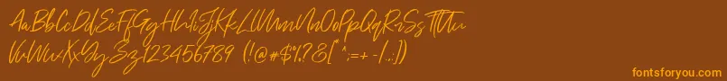 Just Kelly Justine Font – Orange Fonts on Brown Background