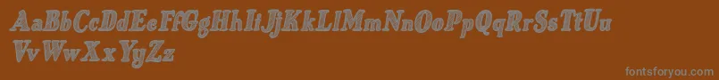 Czcionka Just Mandrawn Italic – szare czcionki na brązowym tle
