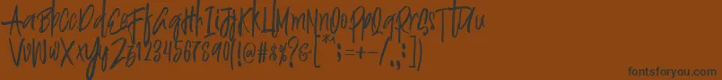 Police Justin Brush Font – polices noires sur fond brun
