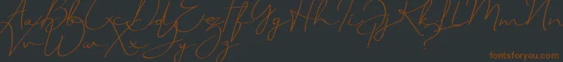 JustSignature Font – Brown Fonts on Black Background