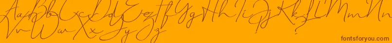 Czcionka JustSignature – brązowe czcionki na pomarańczowym tle