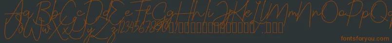 JustwinchSignatureDemo-Schriftart – Braune Schriften auf schwarzem Hintergrund
