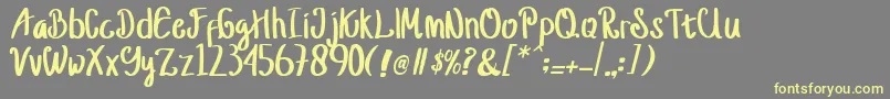 jusy Font – Yellow Fonts on Gray Background