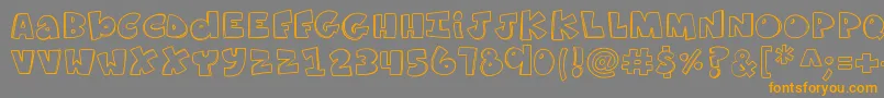 フォントK26ComicKats – オレンジの文字は灰色の背景にあります。