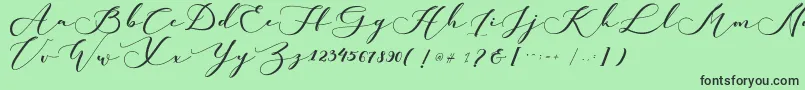 kachine-Schriftart – Schwarze Schriften auf grünem Hintergrund