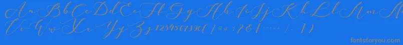 kachine-fontti – harmaat kirjasimet sinisellä taustalla
