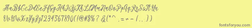 フォントKaeshum – 黄色の背景に灰色の文字