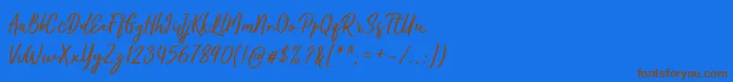 Kaftice-Schriftart – Braune Schriften auf blauem Hintergrund