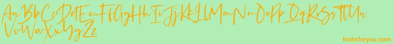 フォントKaileigh 2 – オレンジの文字が緑の背景にあります。