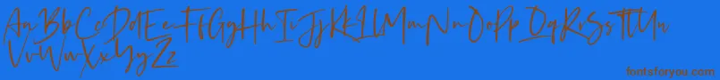 Kaileigh Font – Brown Fonts on Blue Background