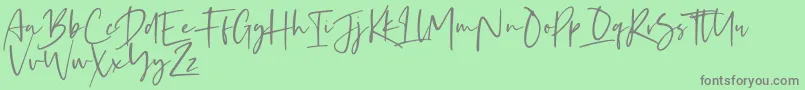 Fonte Kaileigh – fontes cinzas em um fundo verde
