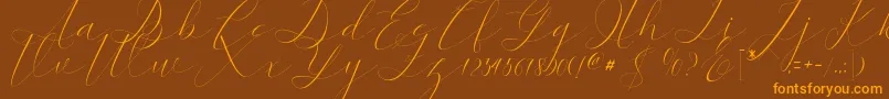 kaitlyne Font – Orange Fonts on Brown Background