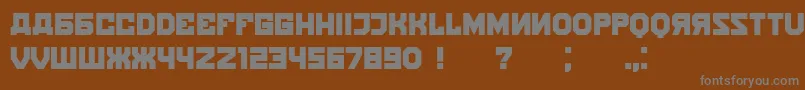 Kalinka-fontti – harmaat kirjasimet ruskealla taustalla