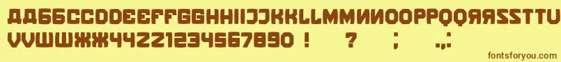 フォントKalinkaDistorted – 茶色の文字が黄色の背景にあります。