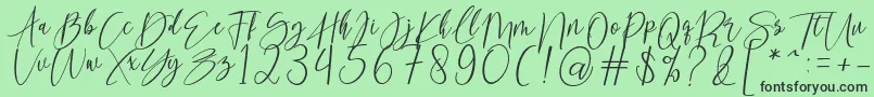 Czcionka kallita – czarne czcionki na zielonym tle