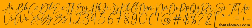 kallita-Schriftart – Schwarze Schriften auf orangefarbenem Hintergrund