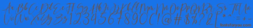 フォントkallita – 茶色の文字が青い背景にあります。