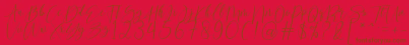 kallita-Schriftart – Braune Schriften auf rotem Hintergrund