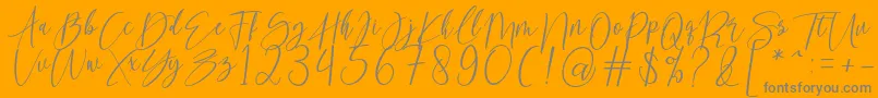 kallita-Schriftart – Graue Schriften auf orangefarbenem Hintergrund