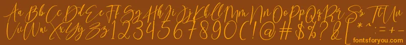 kallita-Schriftart – Orangefarbene Schriften auf braunem Hintergrund