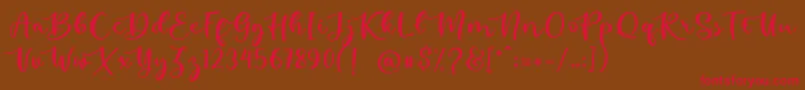 kallithea-Schriftart – Rote Schriften auf braunem Hintergrund