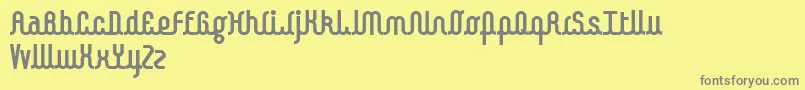 フォントKamalo bold – 黄色の背景に灰色の文字