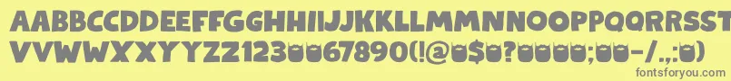 Kapsalon DEMO-Schriftart – Graue Schriften auf gelbem Hintergrund