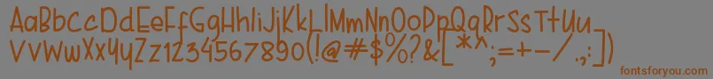 フォントKarenina Handwriting – 茶色の文字が灰色の背景にあります。