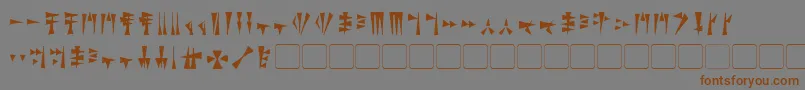 フォントKargi – 茶色の文字が灰色の背景にあります。
