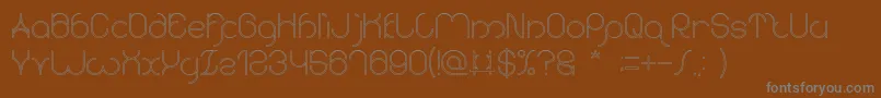 karitza Hollow Font – Gray Fonts on Brown Background