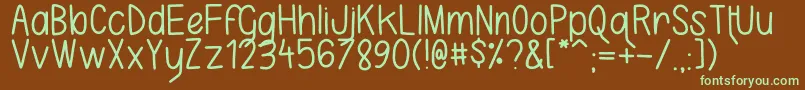 フォントKarlaCamilla – 緑色の文字が茶色の背景にあります。