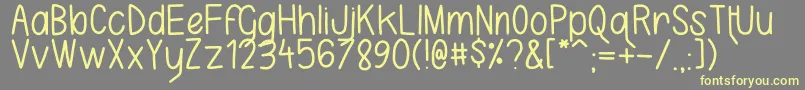 フォントKarlaCamilla – 黄色のフォント、灰色の背景