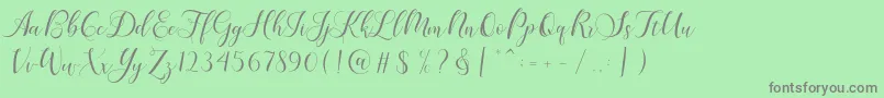 Fonte Karliyna Script – fontes cinzas em um fundo verde