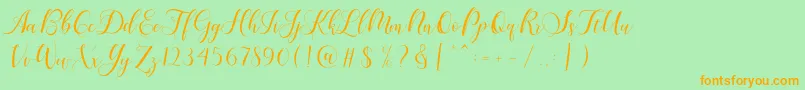 Karliyna Script Font – Orange Fonts on Green Background