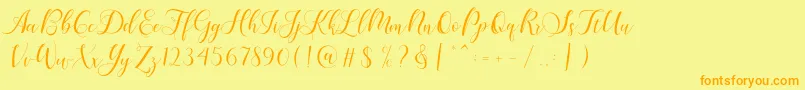 Karliyna Script-fontti – oranssit fontit keltaisella taustalla