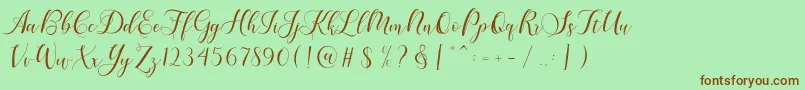 Fonte Karliyna Script – fontes marrons em um fundo verde