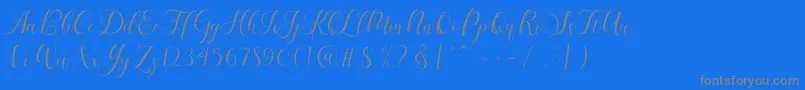 Fonte Karliyna Script – fontes cinzas em um fundo azul