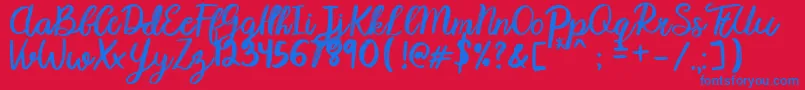 Karmany Regular Font – Blue Fonts on Red Background